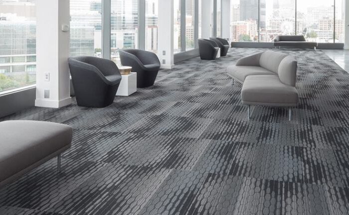 Machine deep-cleaning a commercial office carpet