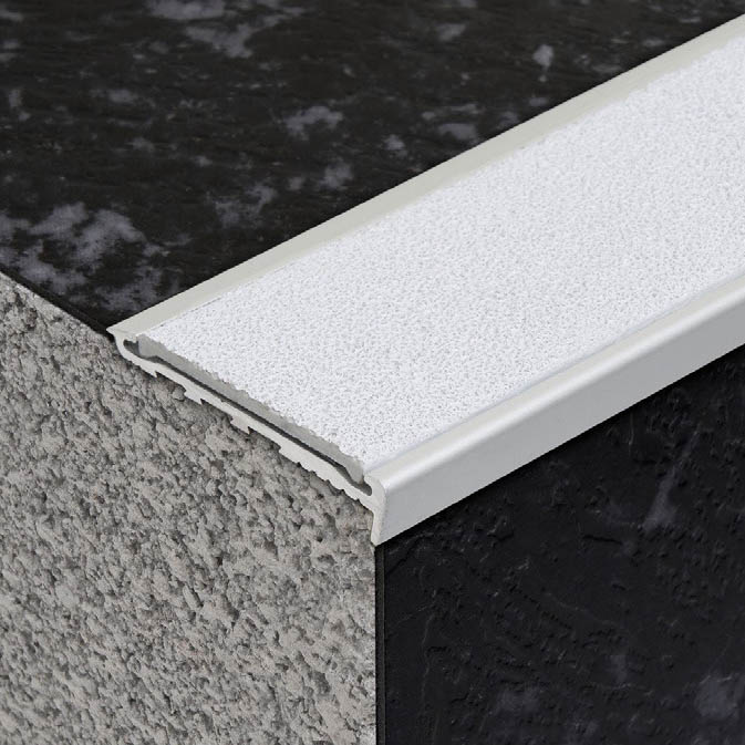 Acoustic vinyl flooring and sound-dampening surface finish