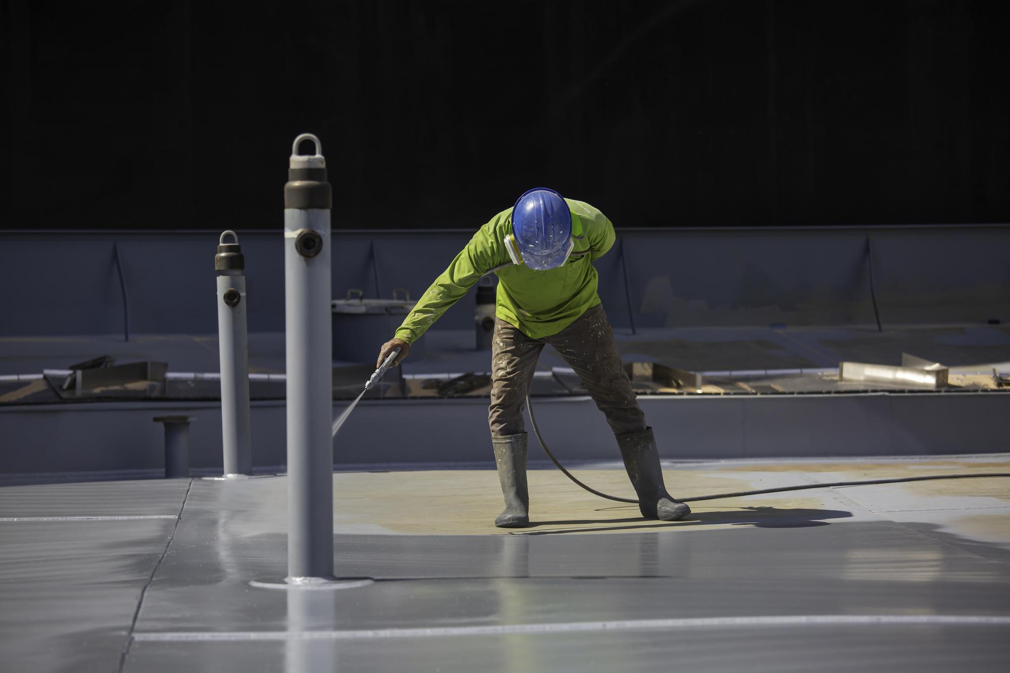 Glossy poured epoxy floor coating in a commercial warehouse